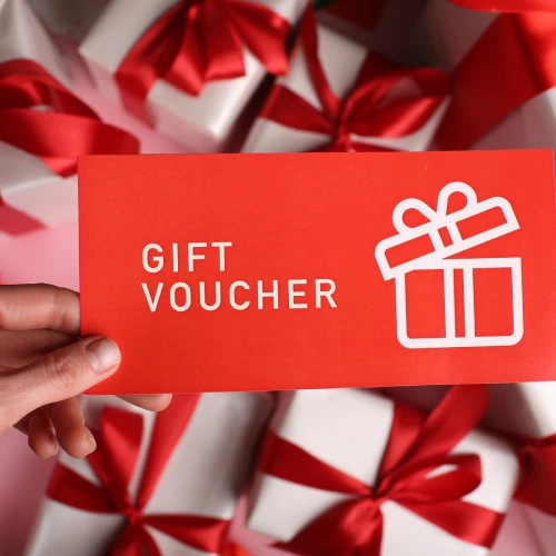 gift certificate coupon voucher lies on gifts